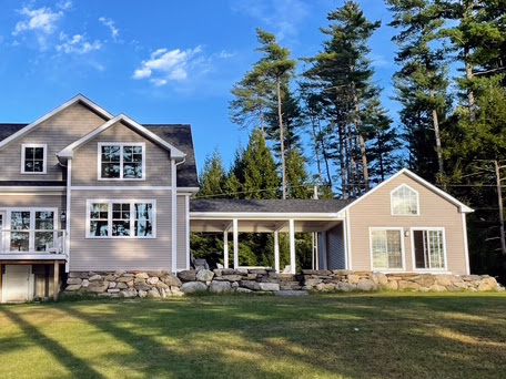 The property in summer with full green canopy