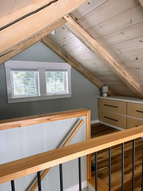 Loft railing looking down toward the stairs